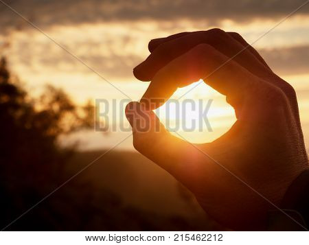 Man Hand Touch Sun. Fingers Circle. Misty Daybreak In A Beautiful Hilly Landscape .