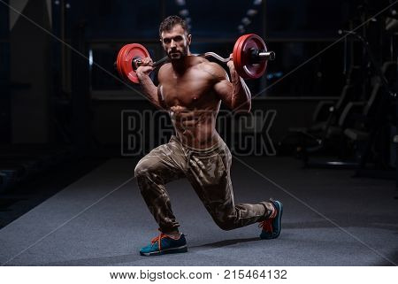 Brutal Strong Bodybuilder Athletic Men Pumping Up Muscles With Dumbbells.