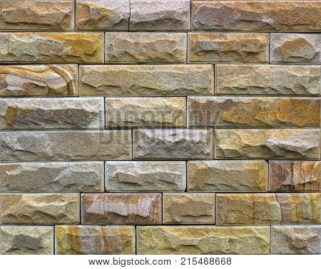 Stone wall texture, travertine tiles facing stone background