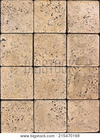 Stone wall texture, travertine tiles facing stone background