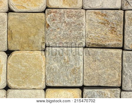 Stone wall texture, travertine tiles facing stone background