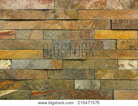 Stone wall texture, travertine tiles facing stone background