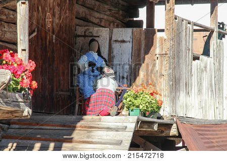 Italy Rocca Pietore - August 26 2016: the view of dummy dolls of handycraft's women on a porch on August 26 2016 Veneto Italy.