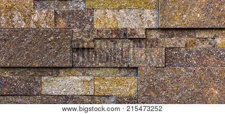 Stone wall texture, travertine tiles facing stone background