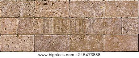Stone wall texture, travertine tiles facing stone background