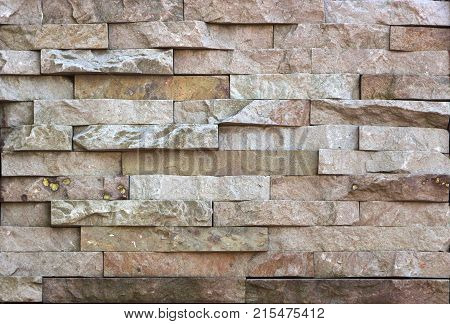 Stone wall texture, travertine tiles facing stone background