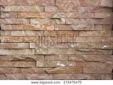 Stone wall texture, travertine tiles facing stone background