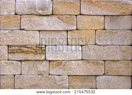 Stone wall texture, travertine tiles facing stone background