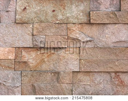 Stone wall texture, travertine tiles facing stone background