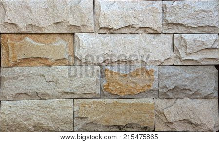 Stone wall texture, travertine tiles facing stone background