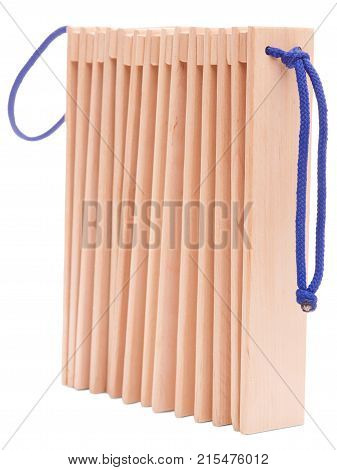 Wooden ethnic musical instruments - ratchet of the plates with two handles, isolated on a white background