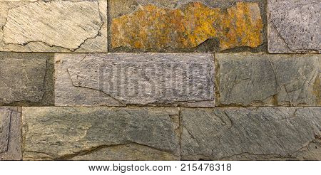 Stone wall texture, travertine tiles facing stone background