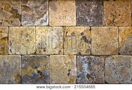 Facing tile from travertine with a smooth surface texture