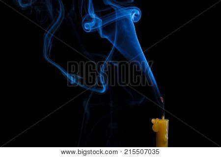 Bizarre smoke trail from an extinguished candle.