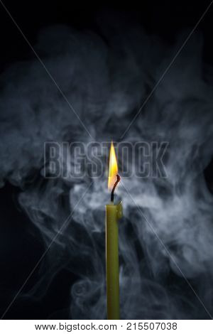 A timid flame of a candle in the fight against darkness.