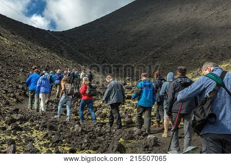 Kamchatka Peninsula, Russia - August 20, 2016: Tourists on excursions in places of Hiking trail climb to the North Breakthrough Great Tolbachik Fissure Eruption 1975