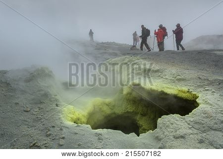Kamchatka Peninsula, Russia - August 26, 2016: Tourists during the ascent to the active volcano Mutnovsky in Kamchatka.