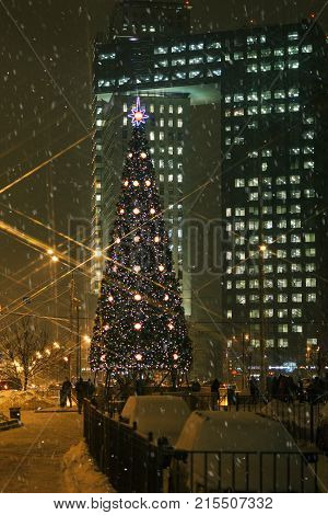 Moscow square in festive attire. Blizzard night.