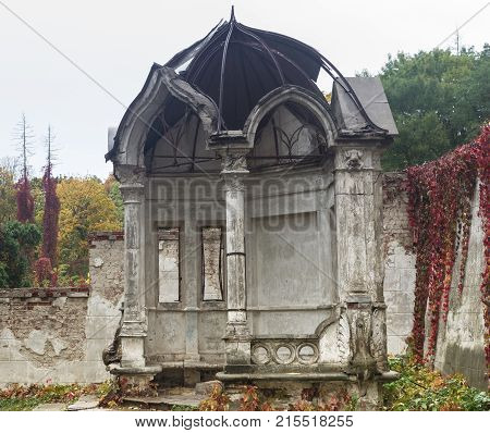 Old abandoned arbor in the autumn park, Konig Palace, Ukraine.