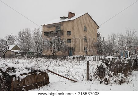 Winter suburb covered with huge amount of white snow. Streets of small town