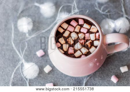 Hot Chocolate  Pink Ceramic Mug Marshmallows And Garland  Gray Knitted Background