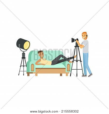 Cartoon guy model character posing lying on couch. Smiling man photographer with headphone and professional camera on tripod. Shooting process in photo studio. Isolated flat design vector illustration