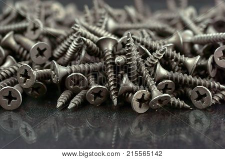 self tapping metal screw with hex head on a white background