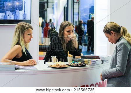 St. Petersburg, Russia - 3 October, Girls standistas behind the counter, 3 October, 2017.
Young girls and women at the St. Petersburg gas forum.