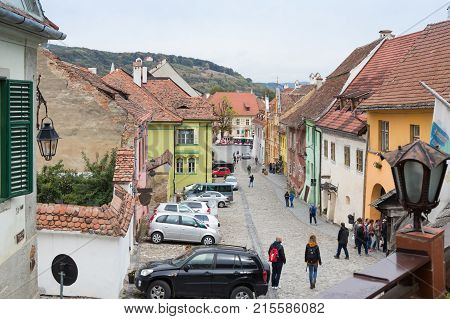 Sighisoara Romania October 08 2017 : School Street in the castle of old city. View from the balcony of the cafe La Scara (On The Ladder). Sighisoara city in Romania