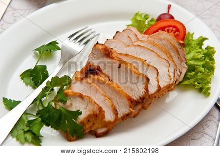 Pork balyk sliced ??with lettuce and tomato leaves