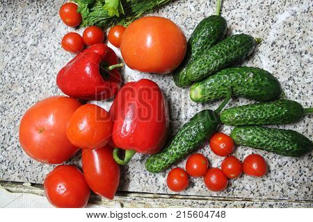 colorful appetizing juicy and crust vegetables red pulp tomato, peppers and crust cucumbers