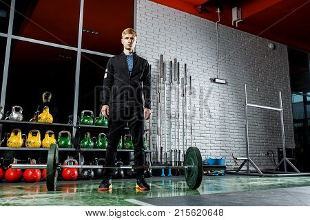 The Guy Is Posing In The Gym