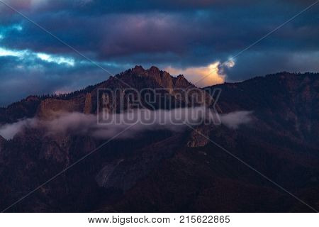 Epic magnificent sunset view of Castle Rock in Sequoia and Kings Canyon National Park after a storm.