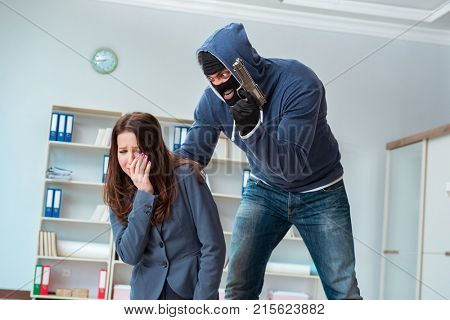 Criminal taking businesswoman as hostage in office