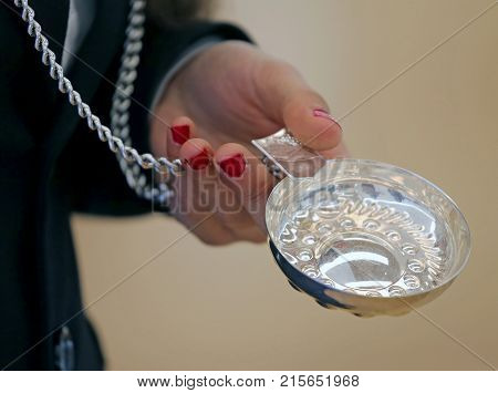 Woman With Red Nail Polish And The Silver Tray To Taste The Wine