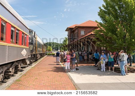 ELKINS, WEST VIRGINIA - JUNE 19, 2016: Tourists ready to board Tygart Flyer ready for trip into mountains of West Virginia by Durbin and Greenbrier Vallery Railroad