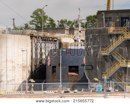 NIAGARA FALLS, CANADA - JUNE 30, 2016: Large metal gates of industrial shipping locks on Welland Canal climbing Niagara Escarpment