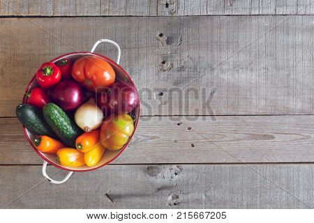 Fresh vegetables on a wooden background. Top view