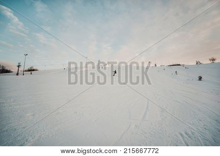 Snowboarder In A Black Helmet Riding On A Snowy Track.