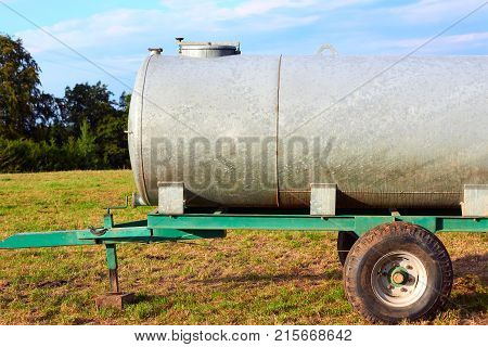 Water trough for drinking for cow cattle in the field Franche Comte France.