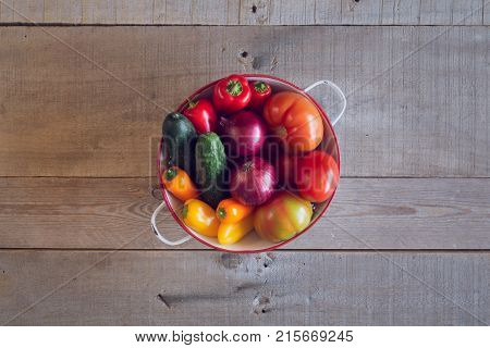 Fresh vegetables on a wooden background. Top view