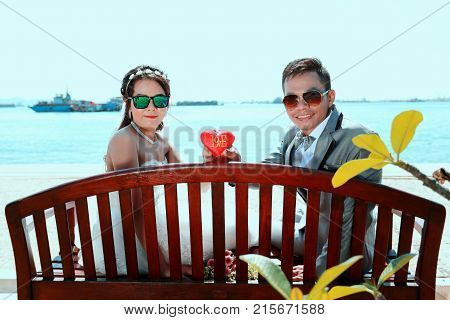 Asian couple photographed before marriage is Pre-wedding on Koh Si Chang Island Popular locations in the Chonburi province at Thailand.