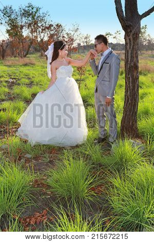 Asian couple photographed before marriage is Pre-wedding on Koh Si Chang Island Popular locations in the Chonburi province at Thailand.