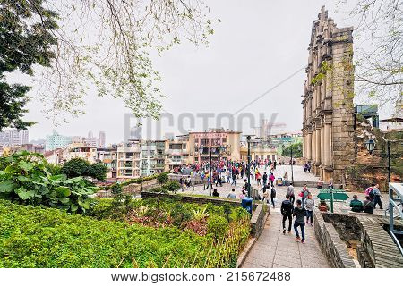 Macao China - March 8 2016: People near Ruins of Saint Paul Church in Historical old city center in Macao China. People on the background
