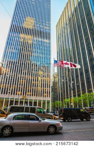 New York USA - May 6 2015: Street view on Avenue of the Americas and Exxon Building and Time-Life Building. Midtown Manhattan New York NYC USA