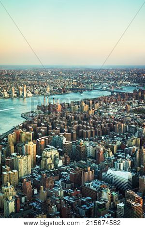 View from Empire state building on East Village in Downtown Manhattan New York NYC USA Williamsburg Bridge Williamsburg Brooklyn. East River and Atlantic Ocean on the background.