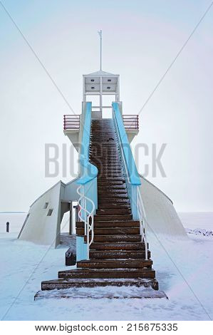 Lighthouse with stairs at the Baltic Sea in winter Oulu Lapland Finland.