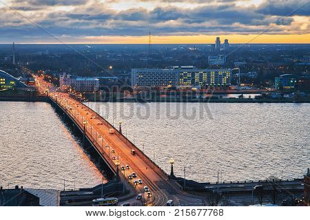 Panoramic view of Akmens Bridge over Daugava River in Riga at sunset in winter