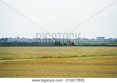 Tractor doing agricultural work in the field of Austria in summer