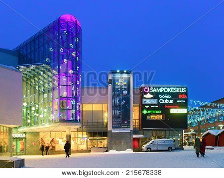 Rovaniemi Finland - March 1 2017: Tourists on Lordi Square in winter Rovaniemi Lapland in Finland at night.